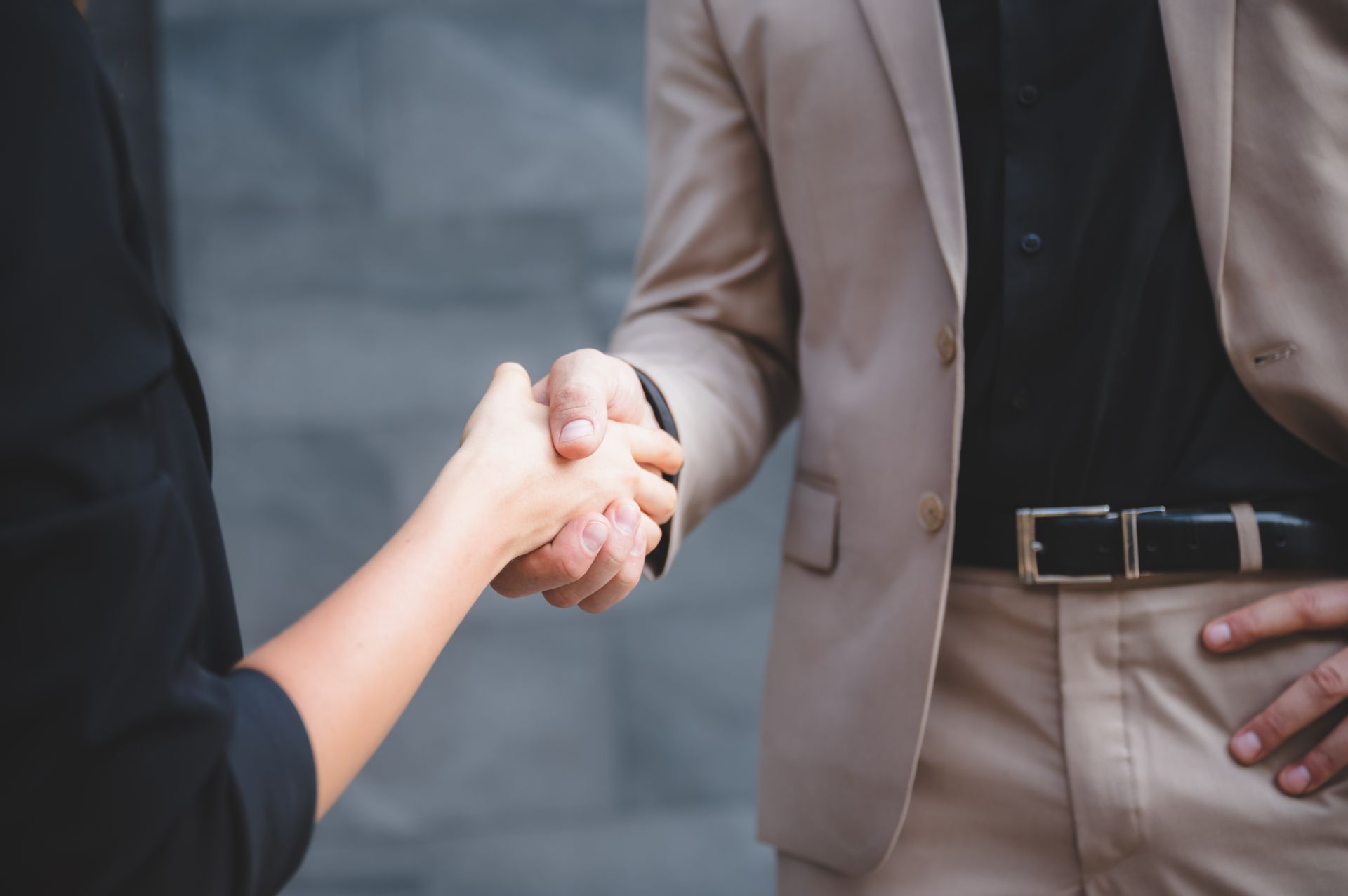 Man and woman shaking hands during a legal consultation in Falls Church, Virginia